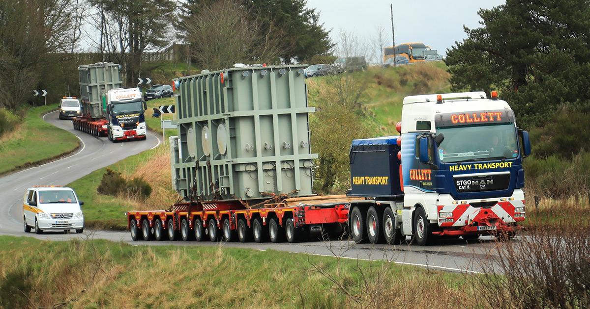 Two Trucks In Convoy with Traffic Behind